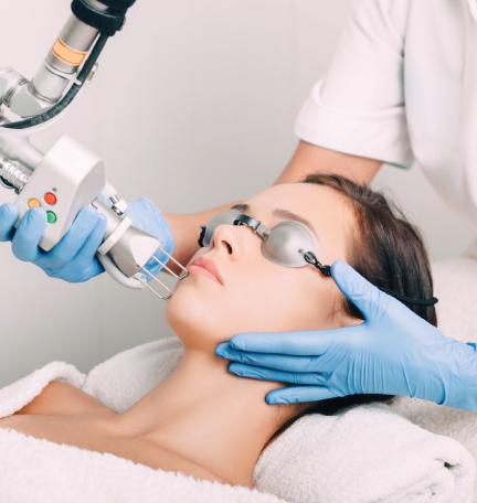 Laser skin resurfacing treatment at a dermatology clinic to improve skin texture and reduce blemishes.
