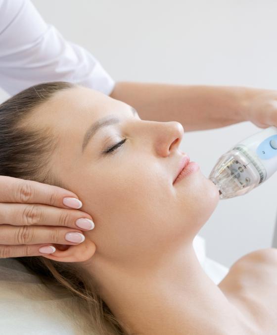 Microneedling treatment at dermatology clinic to boost collagen, reduce wrinkles, and improve skin texture.