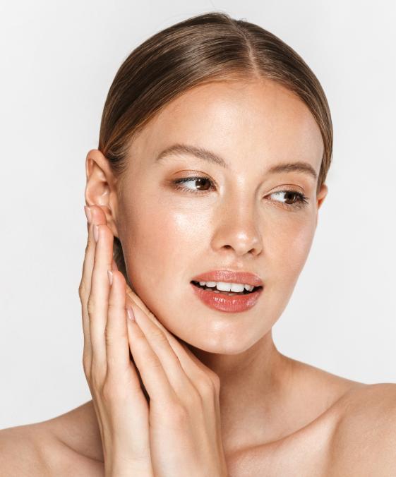 woman with radiant skin after dermatology facial treatment for hydration and skin rejuvenation