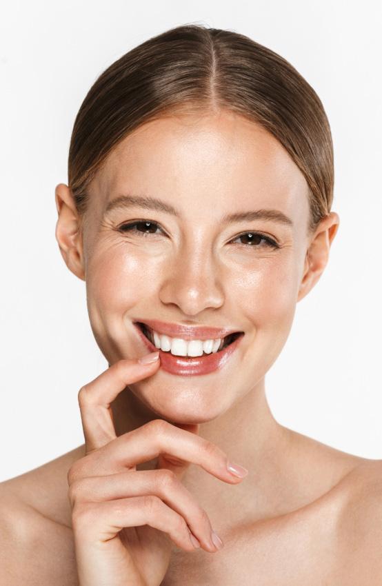 woman with radiant skin after dermatology facial treatment for hydration and skin rejuvenation