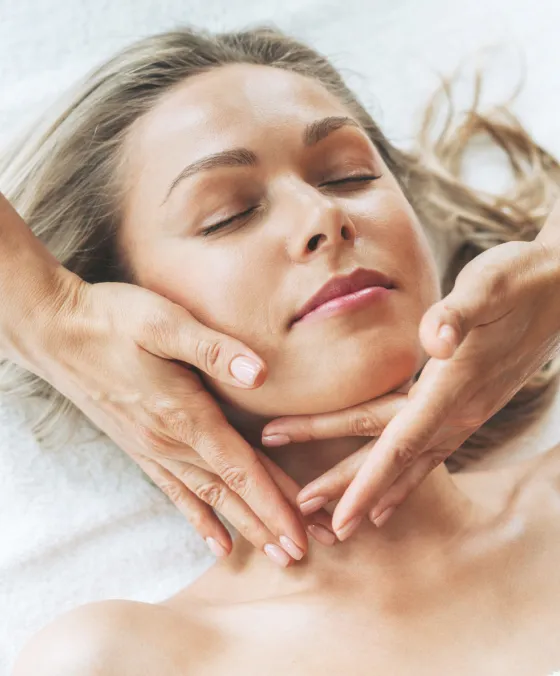 Facial massage at dermatology clinic to improve circulation, relax muscles, and enhance skin rejuvenation.