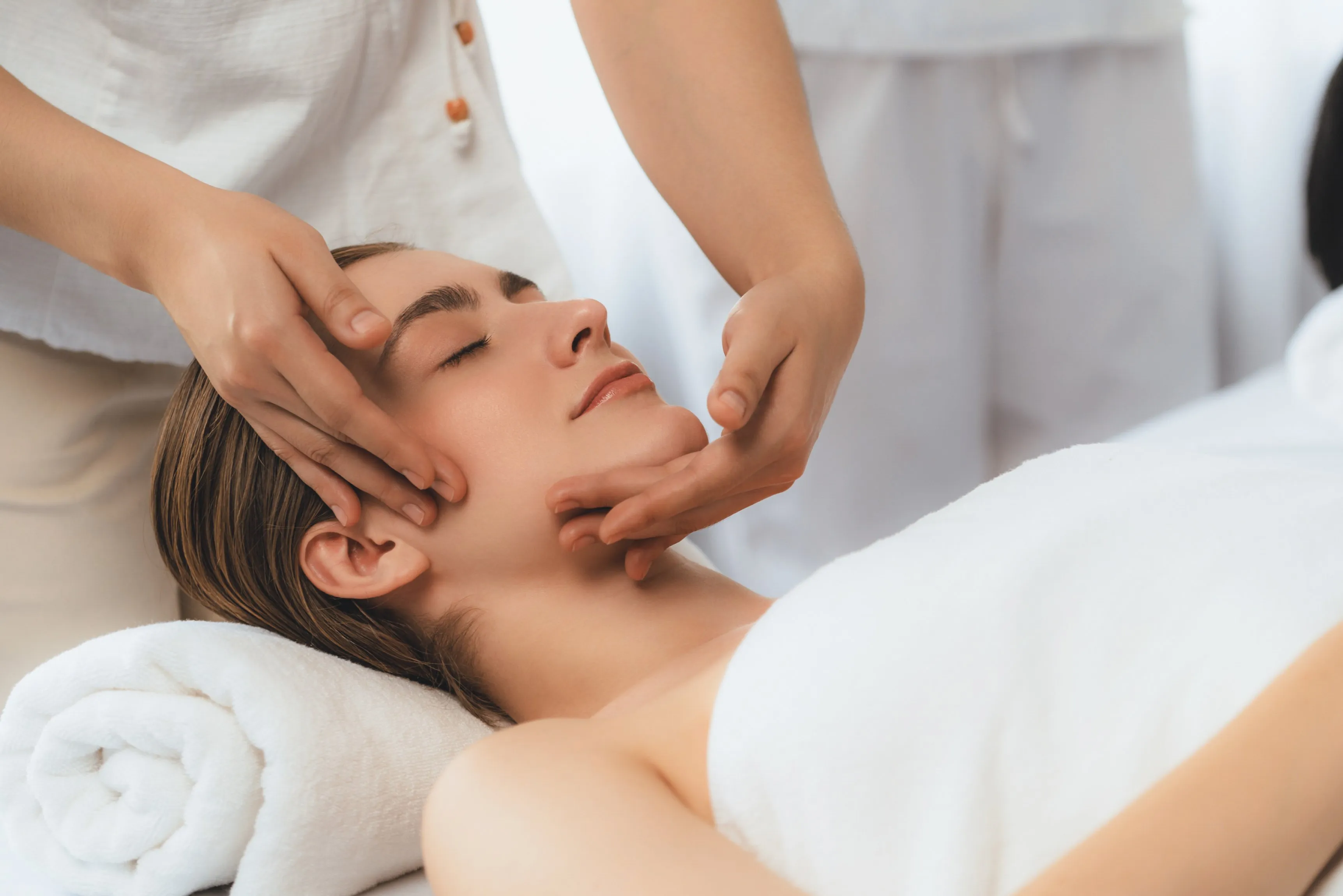 relaxing facial massage at dermatology clinic for improved circulation and skin rejuvenation