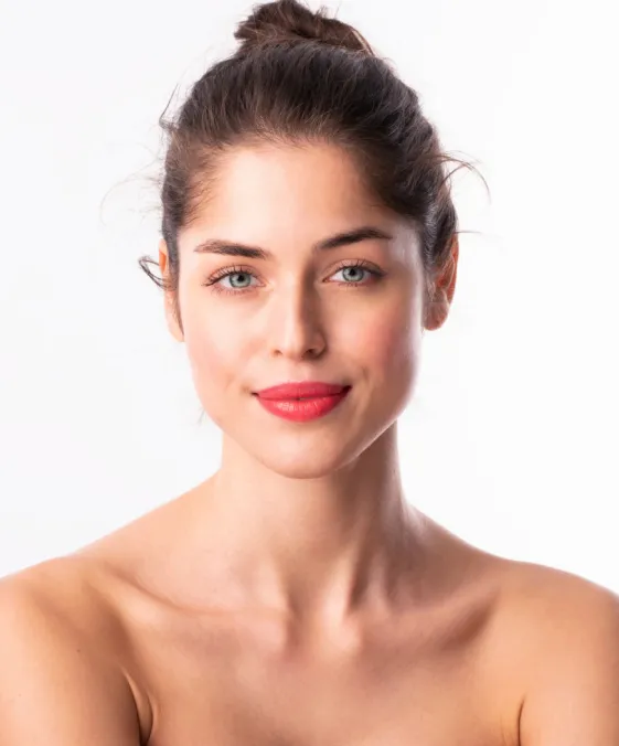 woman with radiant skin after dermatology facial treatment for hydration and skin rejuvenation