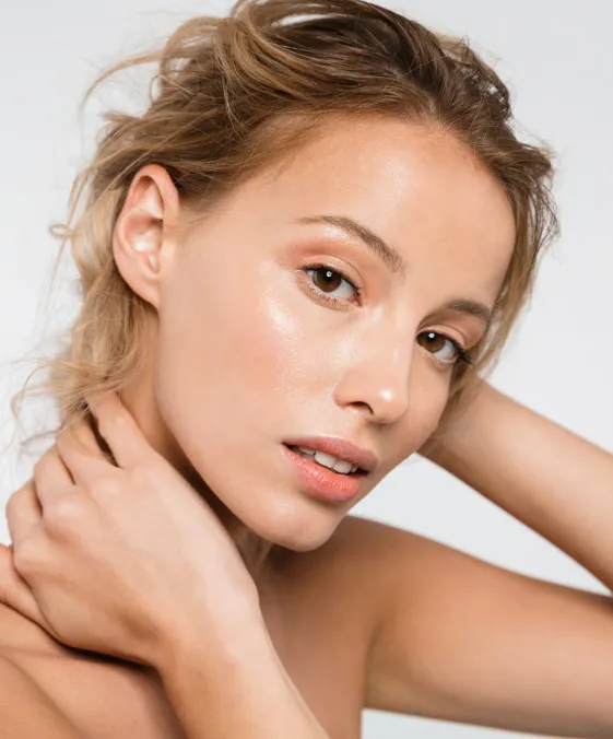 woman with radiant skin after dermatology facial treatment for hydration and skin rejuvenation