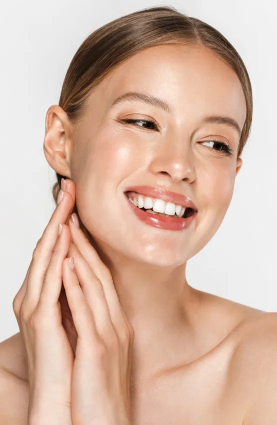 woman with radiant skin after dermatology facial treatment for hydration and skin rejuvenation