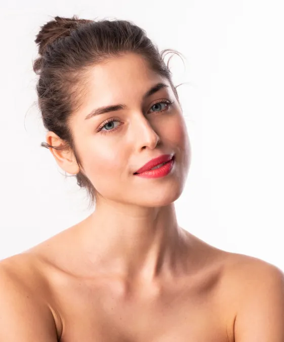 woman with radiant skin after dermatology facial treatment for hydration and skin rejuvenation