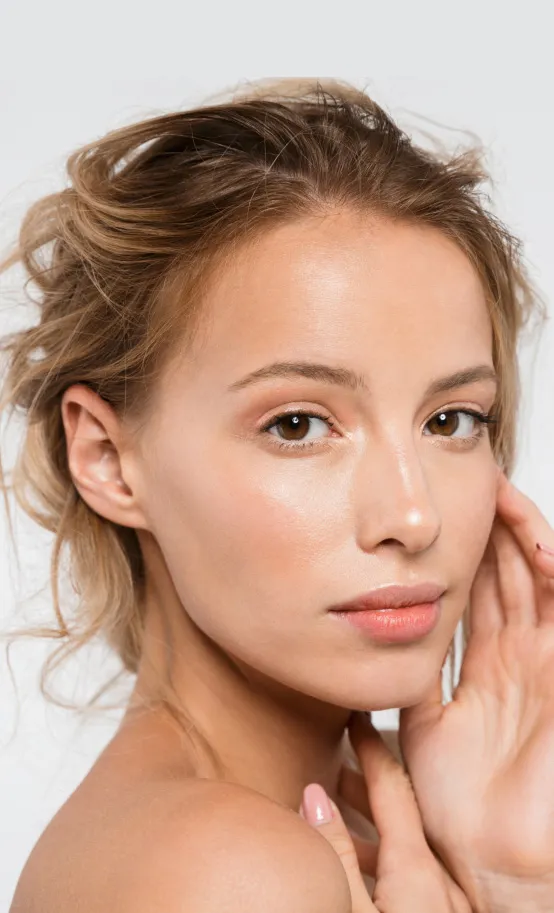 woman with radiant skin after dermatology facial treatment for hydration and skin rejuvenation