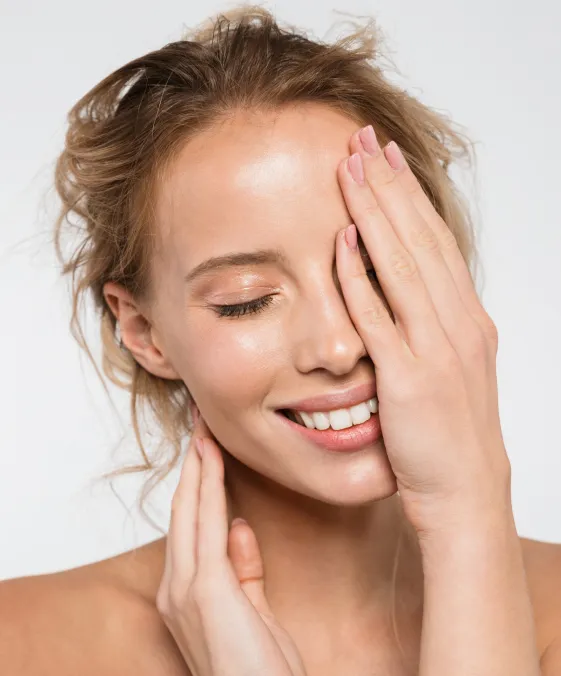 woman with radiant skin after dermatology facial treatment for hydration and skin rejuvenation