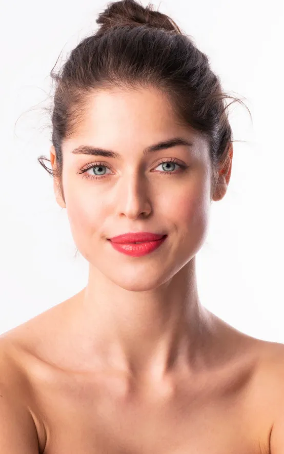 woman with radiant skin after dermatology facial treatment for hydration and skin rejuvenation