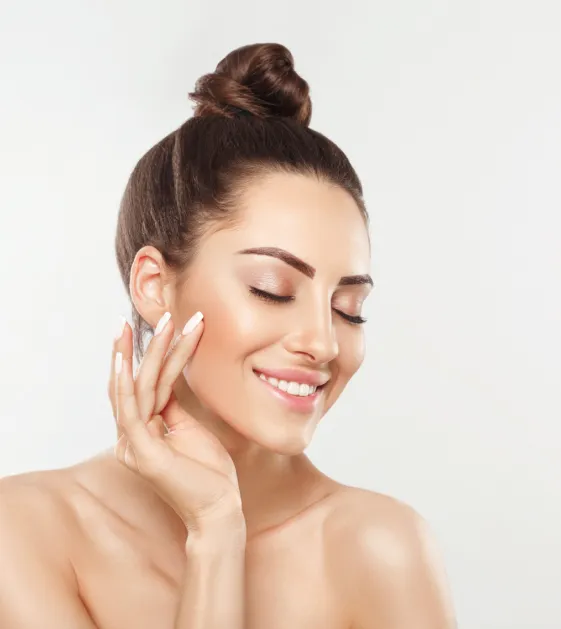 woman with radiant skin after dermatology facial treatment for hydration and skin rejuvenation